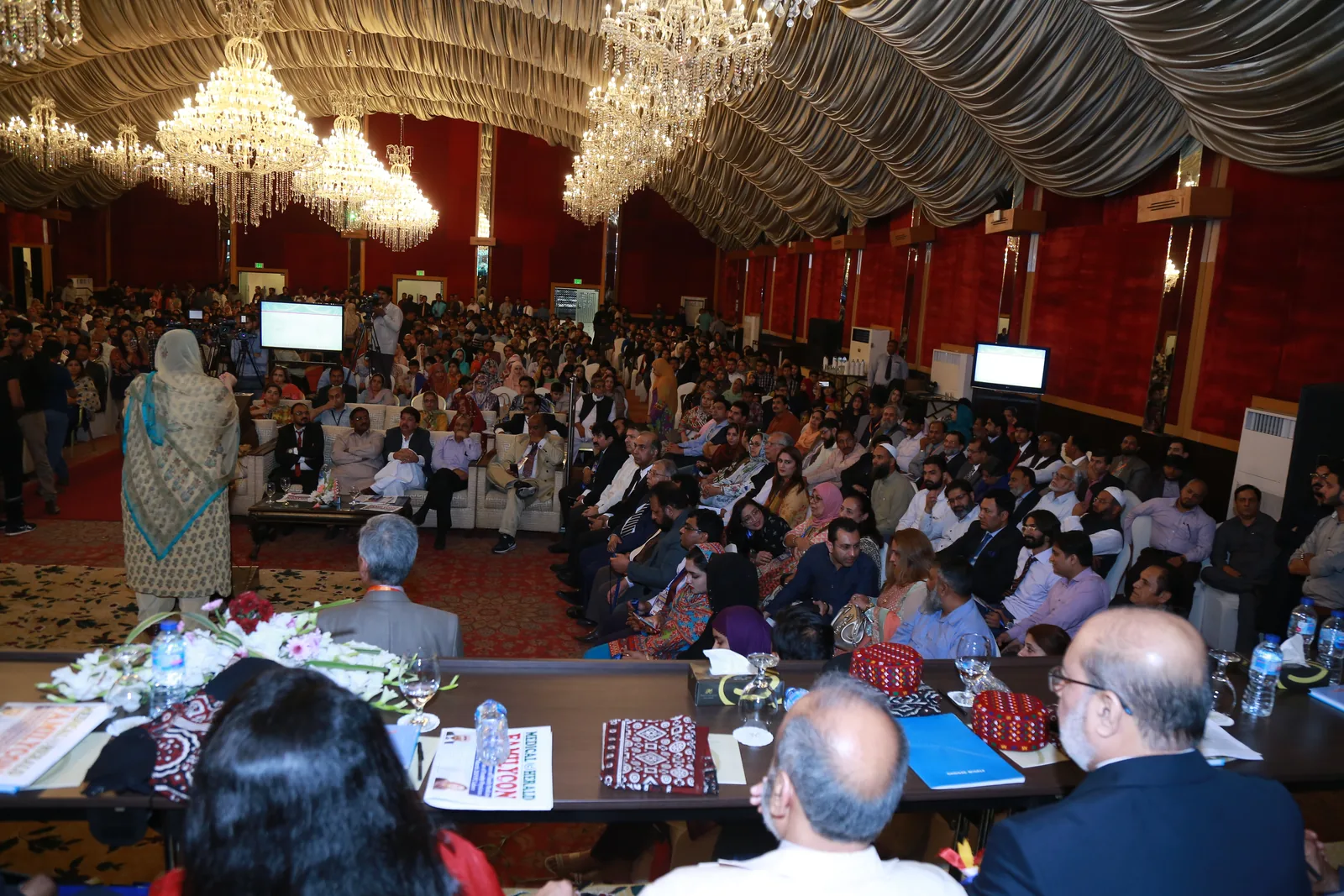 A previous FamilyCon conference gathering in an auditorium with delegates and medical professionals